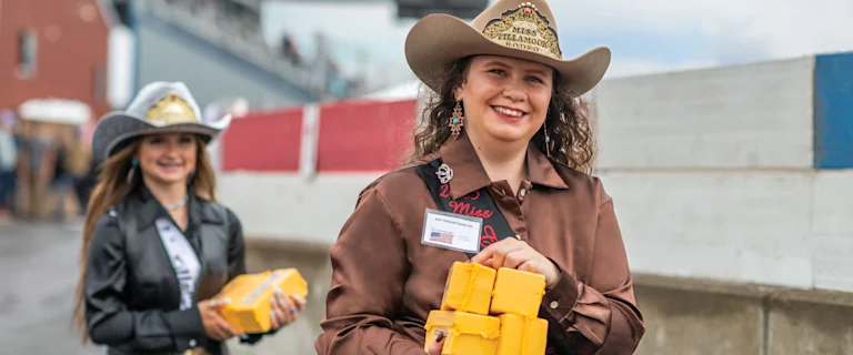 Cowgirls holding cheese packs