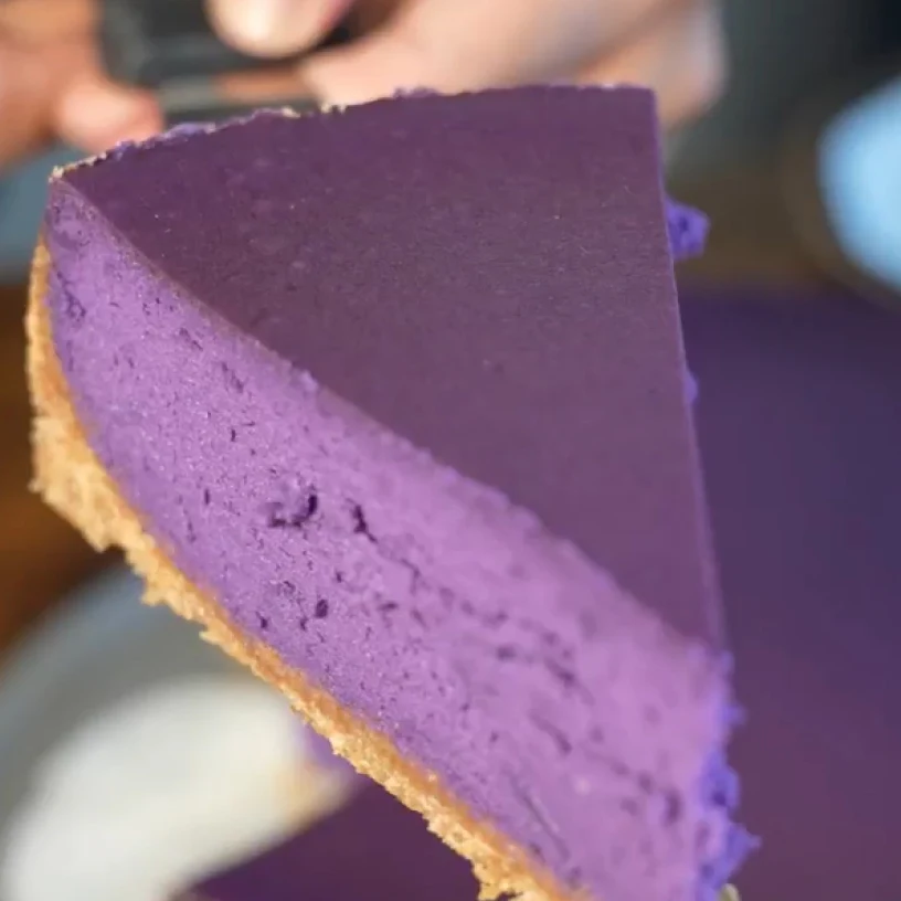 Slice of Ube Cheesecake made with Tillamook Cream Cheese