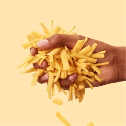 Hand holding Tillamook Cheddar Cheese Shreds