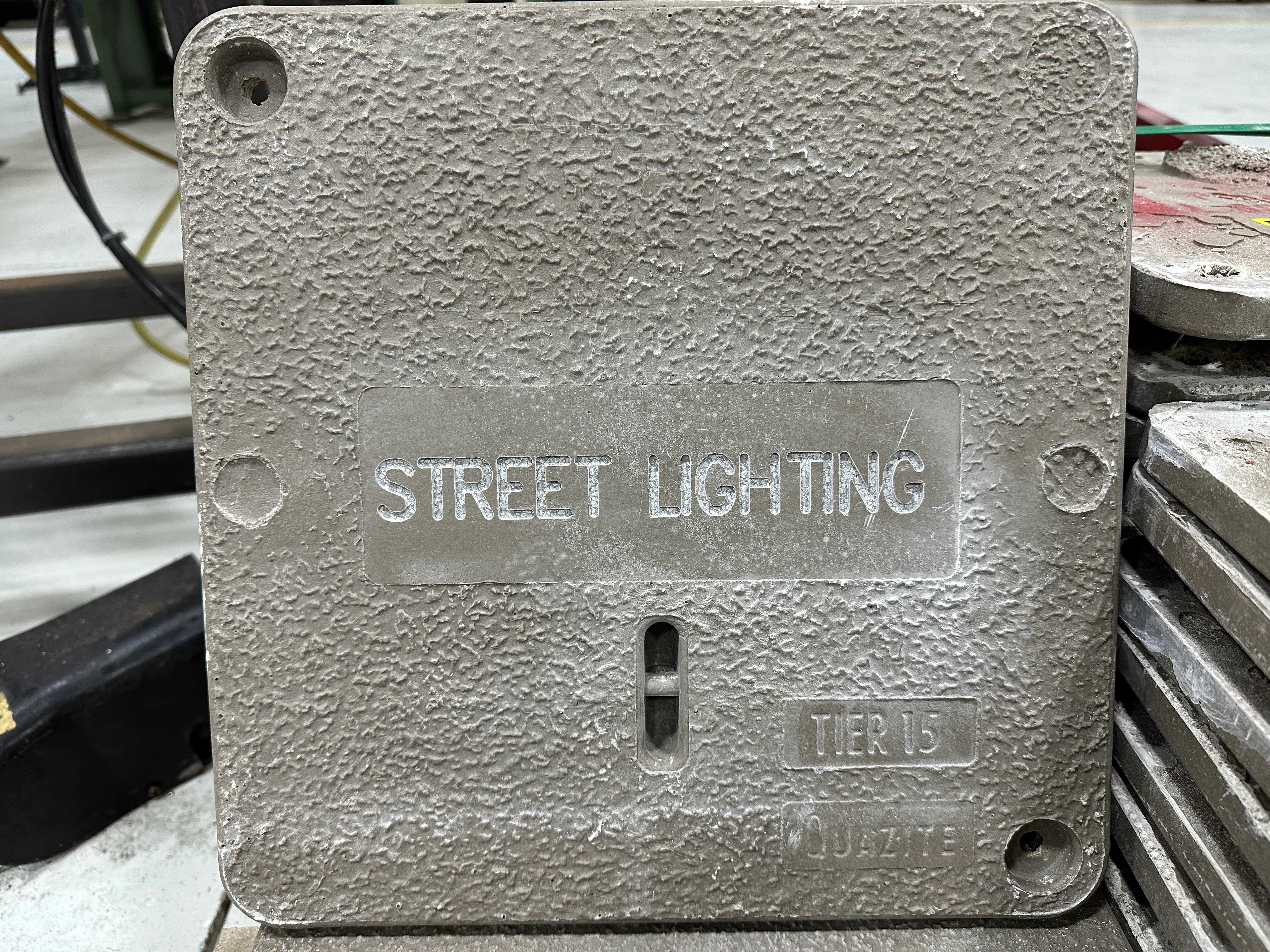 Concrete box cover engraved with the words Street Lighting