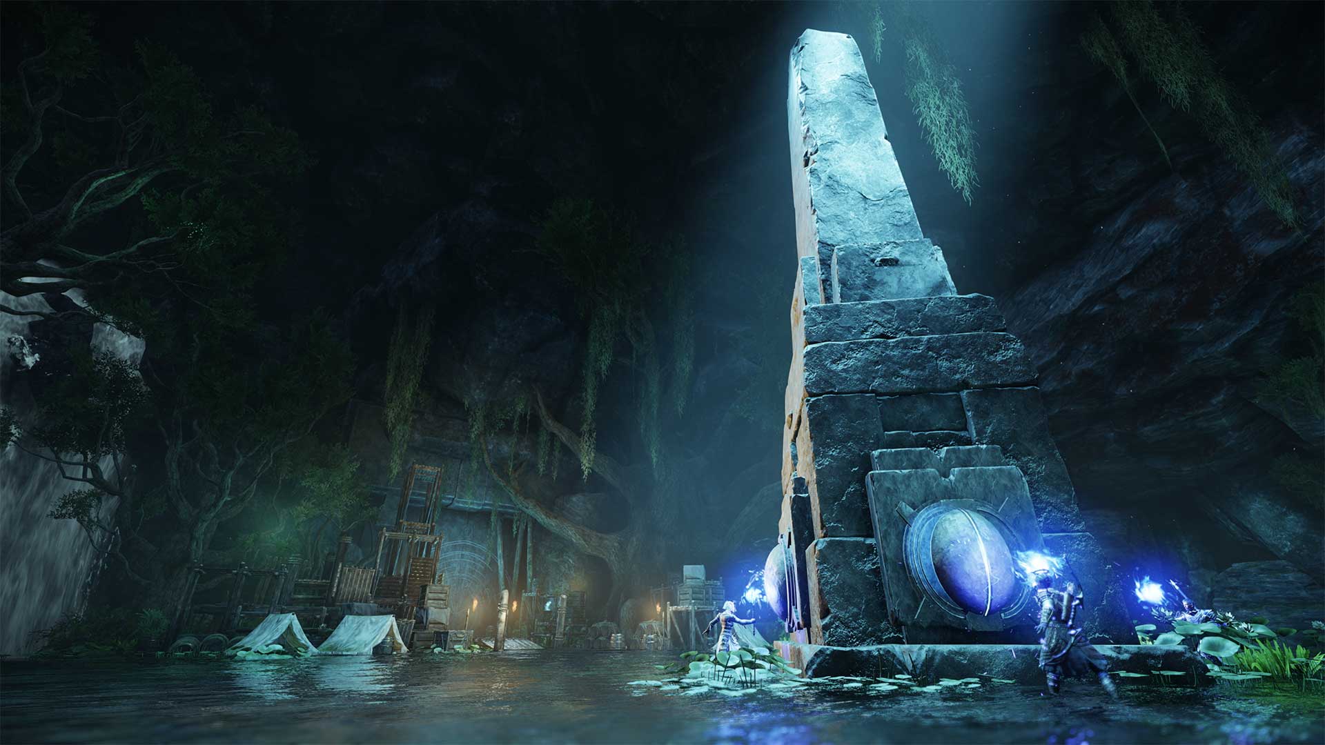 Characters holding blue-flame torches stand on each face of a towering stone obelisk inside a dark arena. 