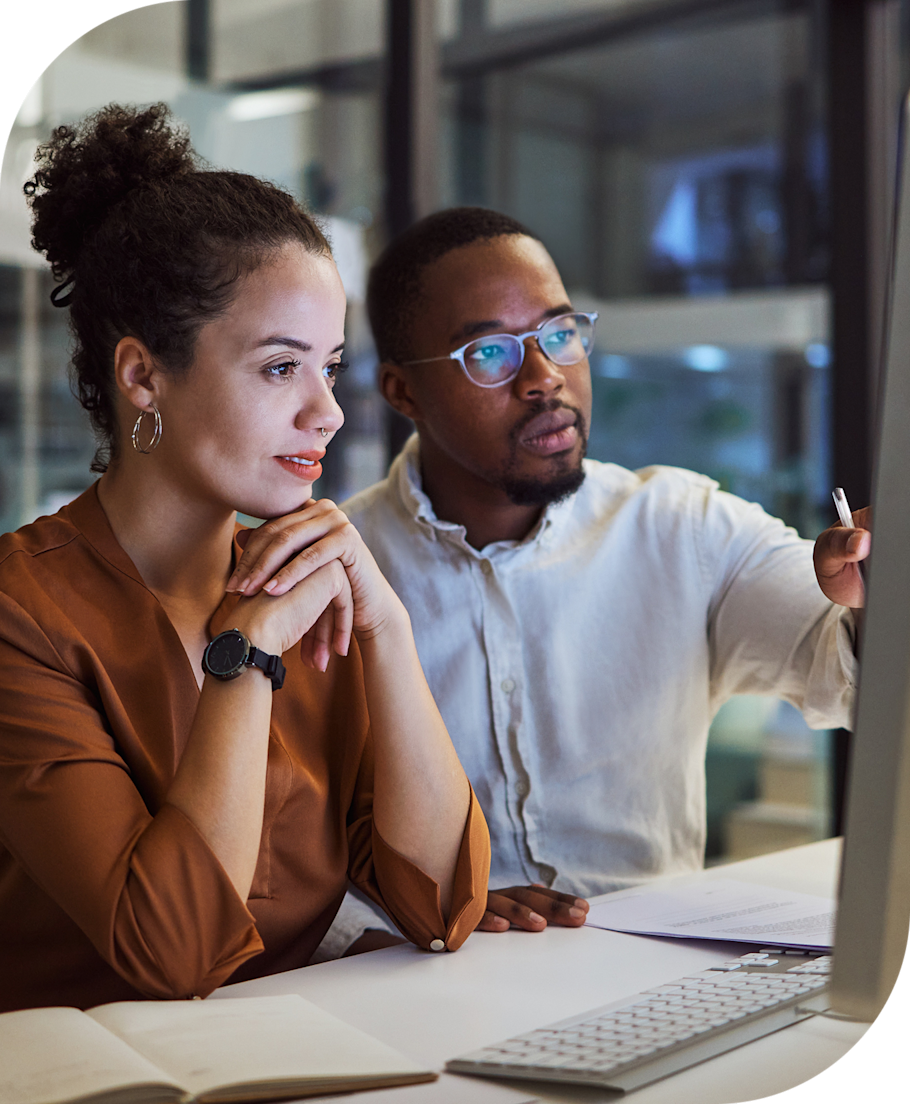 man and woman looking at a computer screen