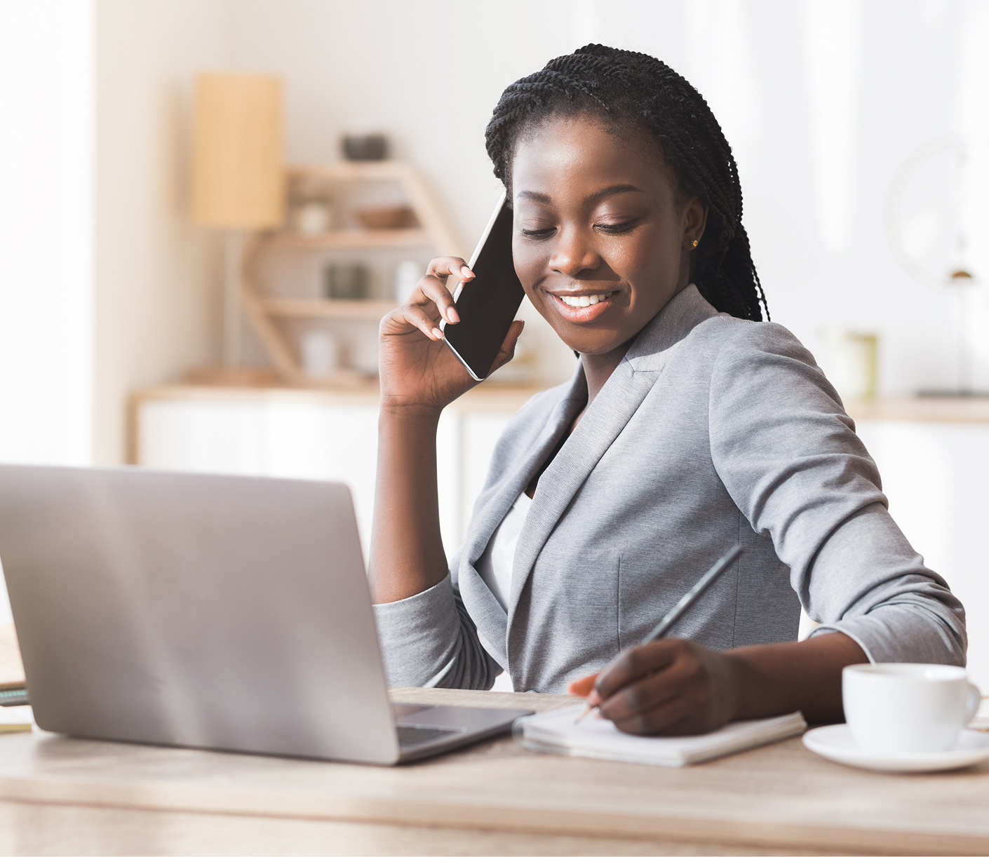 Let a tax expert do your taxes from start to file a lady Infront of her laptop smiling