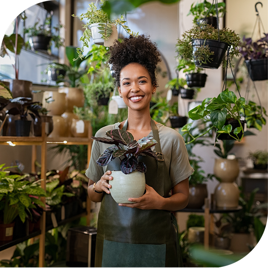 A lady holding a plant