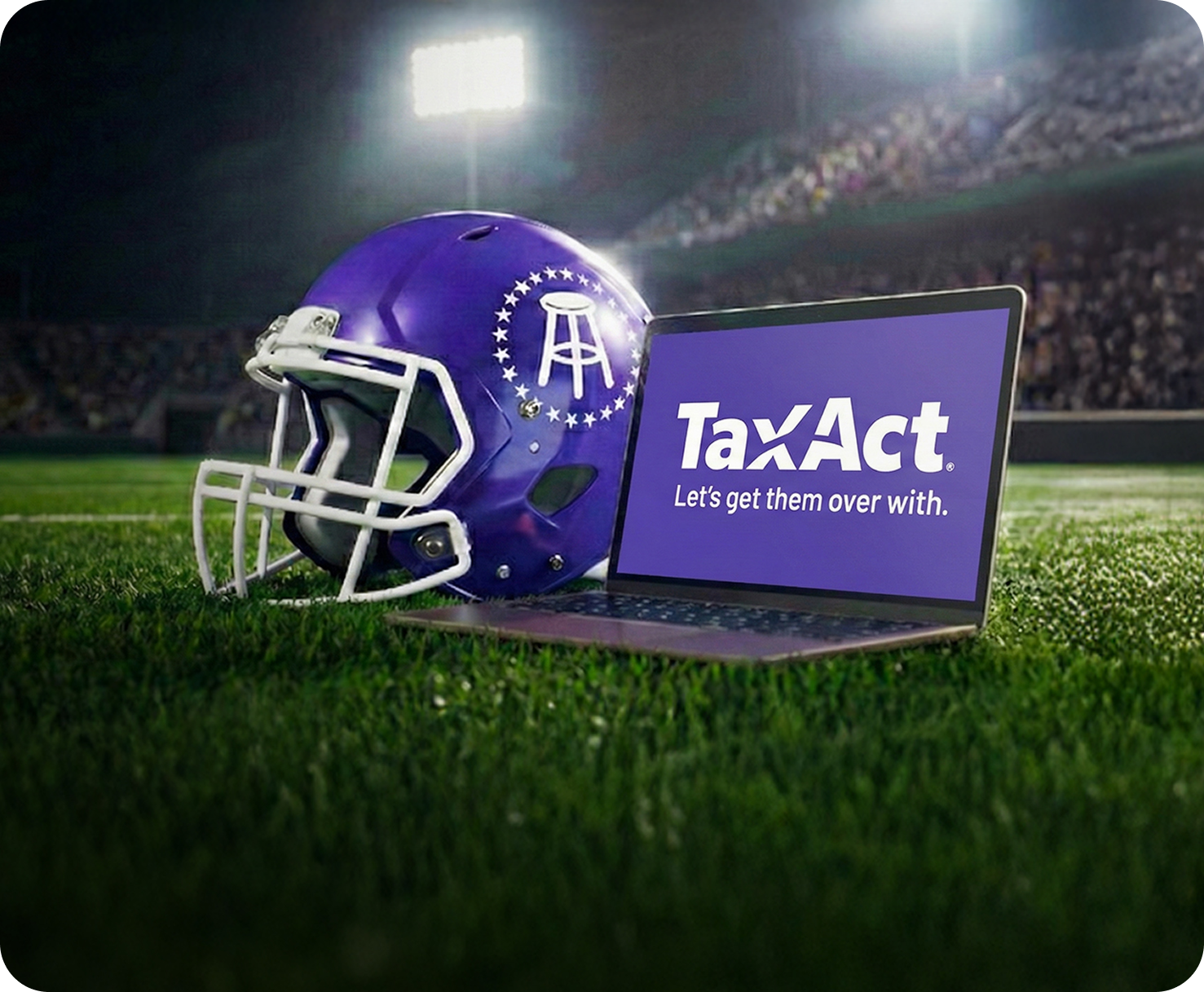 a lady writing in a note book while working on laptop