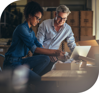 Image of two professional working on laptop