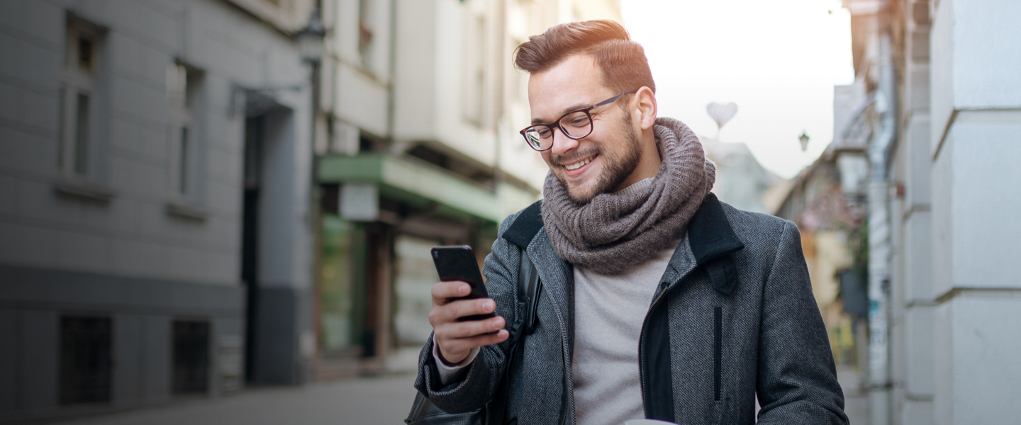 Happy person looking into phone