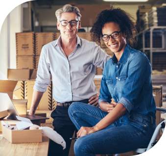 Trusted filing with guaranteed accuracy image two men smiling in warehouse