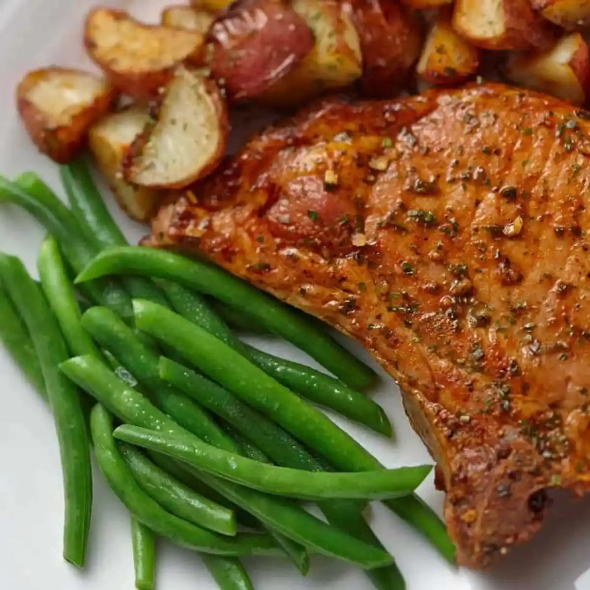 Pork chop with green beans and roasted potatoes