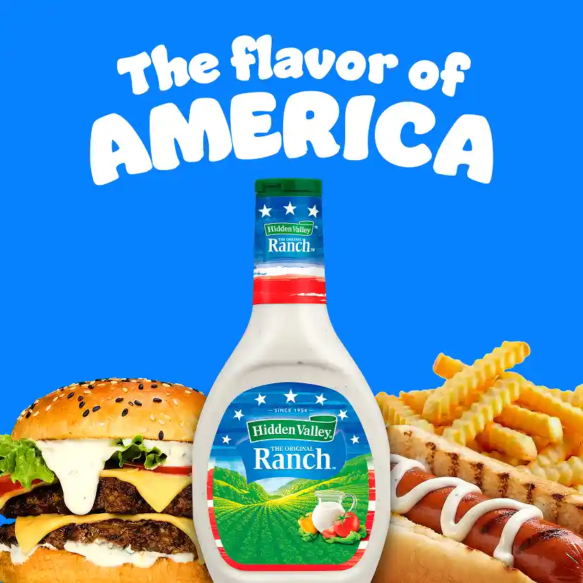 The flavor of America. A 16 oz bottle of Original Ranch with an American flag label in front of various foods