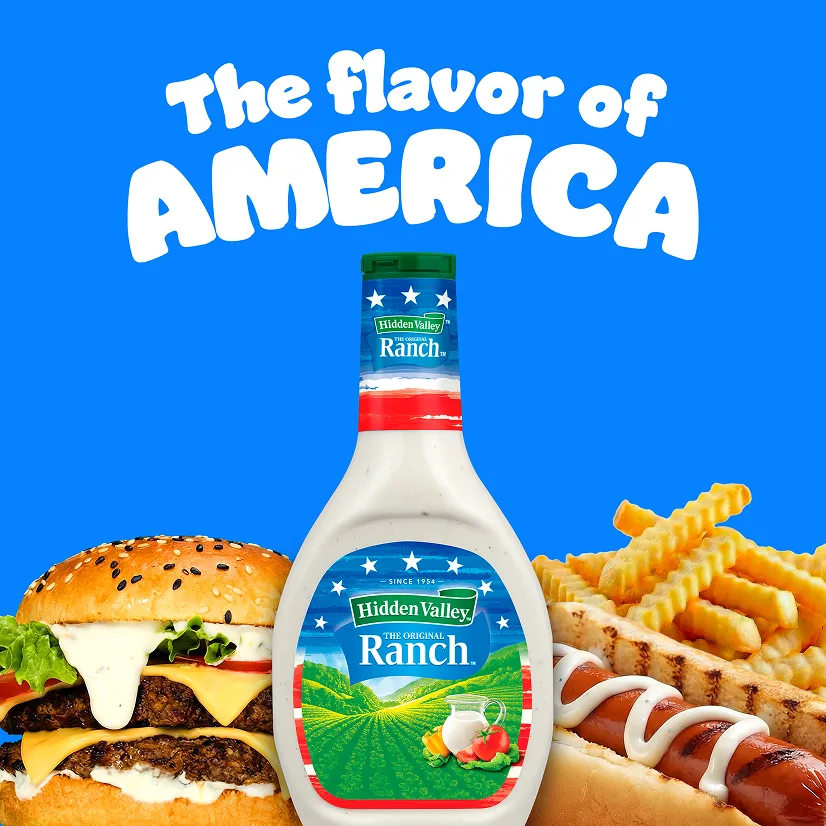 The flavor of America. A 16 oz bottle of Original Ranch with an American flag label in front of various foods