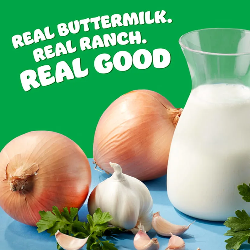 Onions, garlic and a carafe of milk on a blue table with green background. The text: Real buttermilk. Real ranch. Real good.