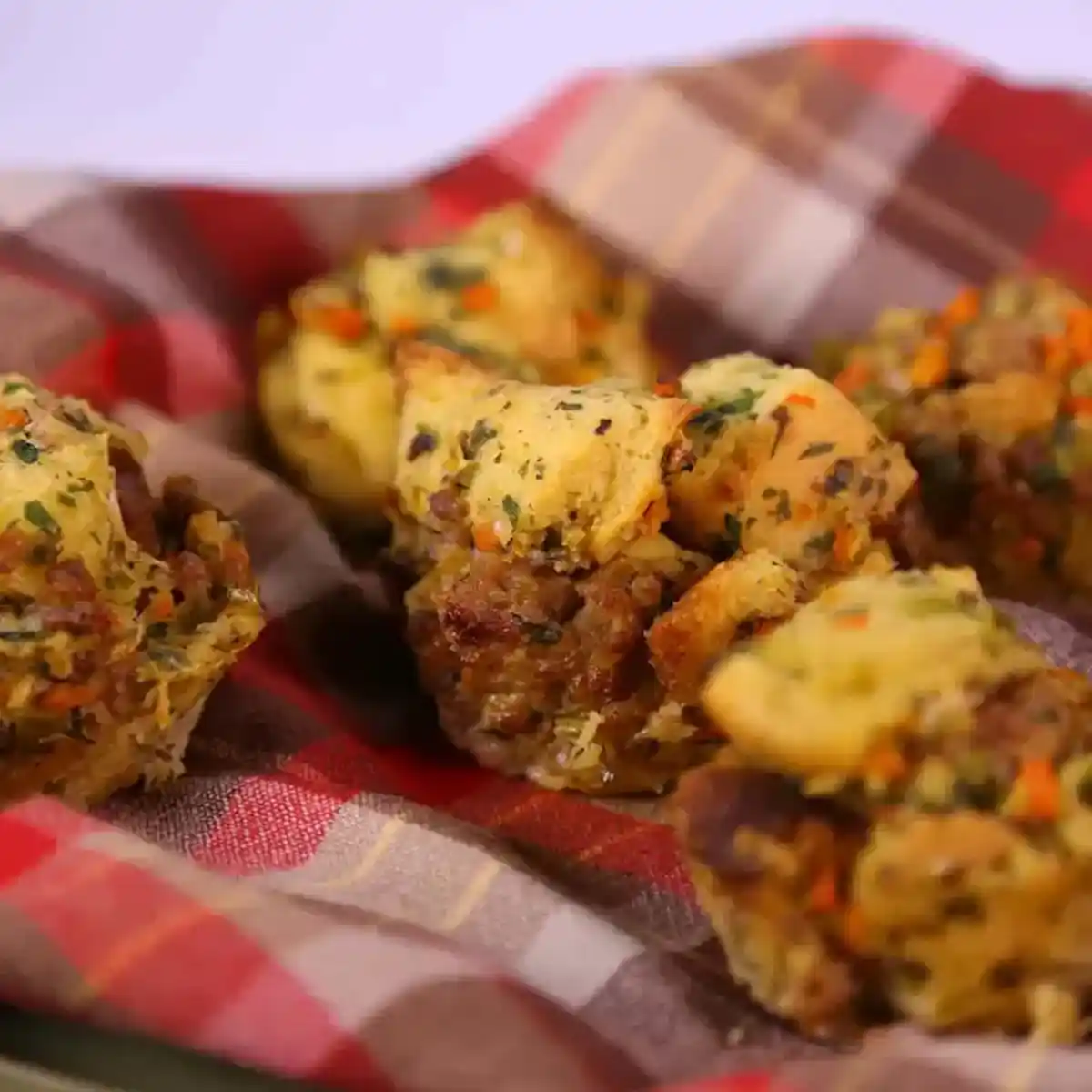 Stuffing muffins on a plaid napkin