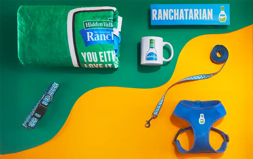 Hidden Valley Ranch blanket, mug, dog collar, leash and harness on a green and yellow background