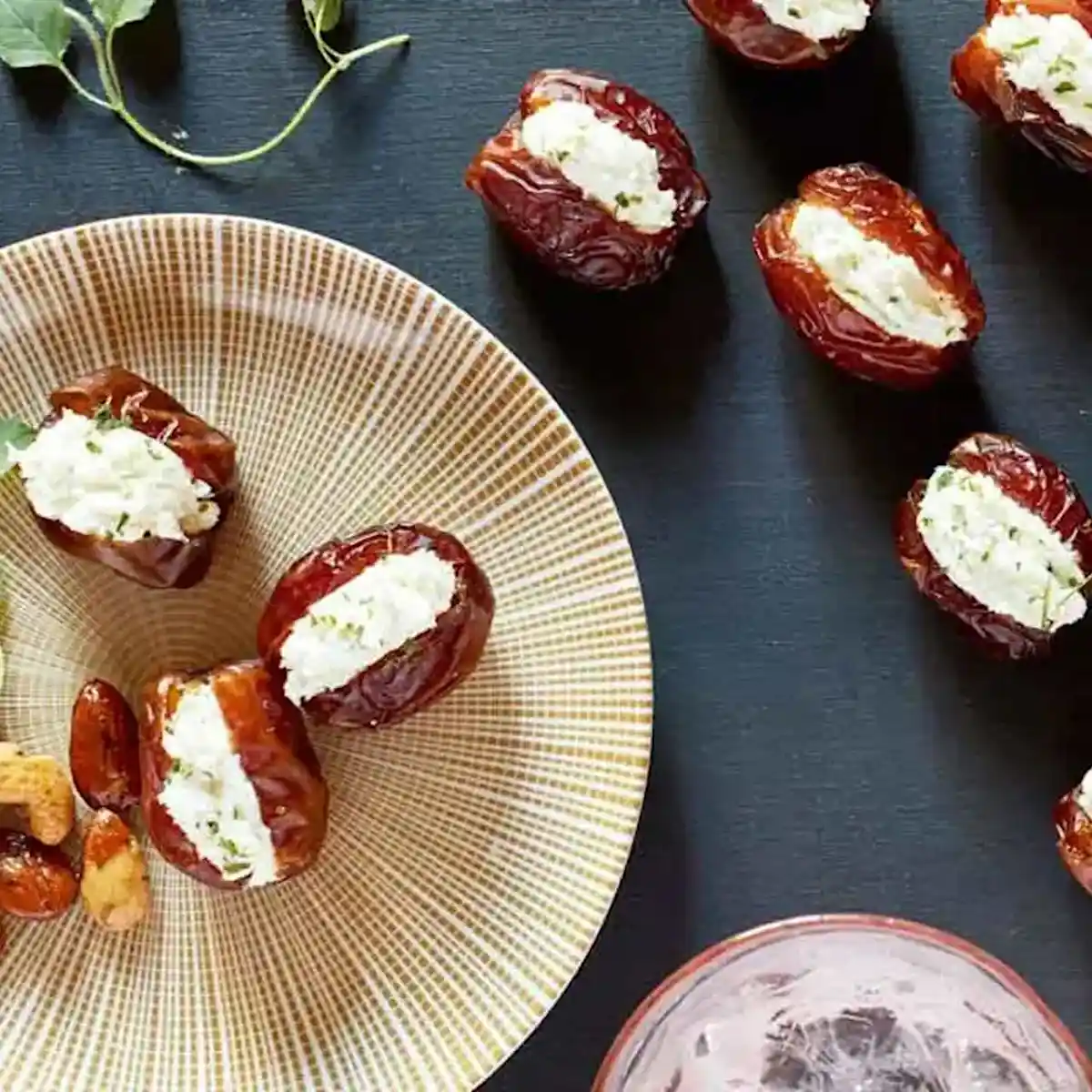 Stuffed dates on a plate and black background