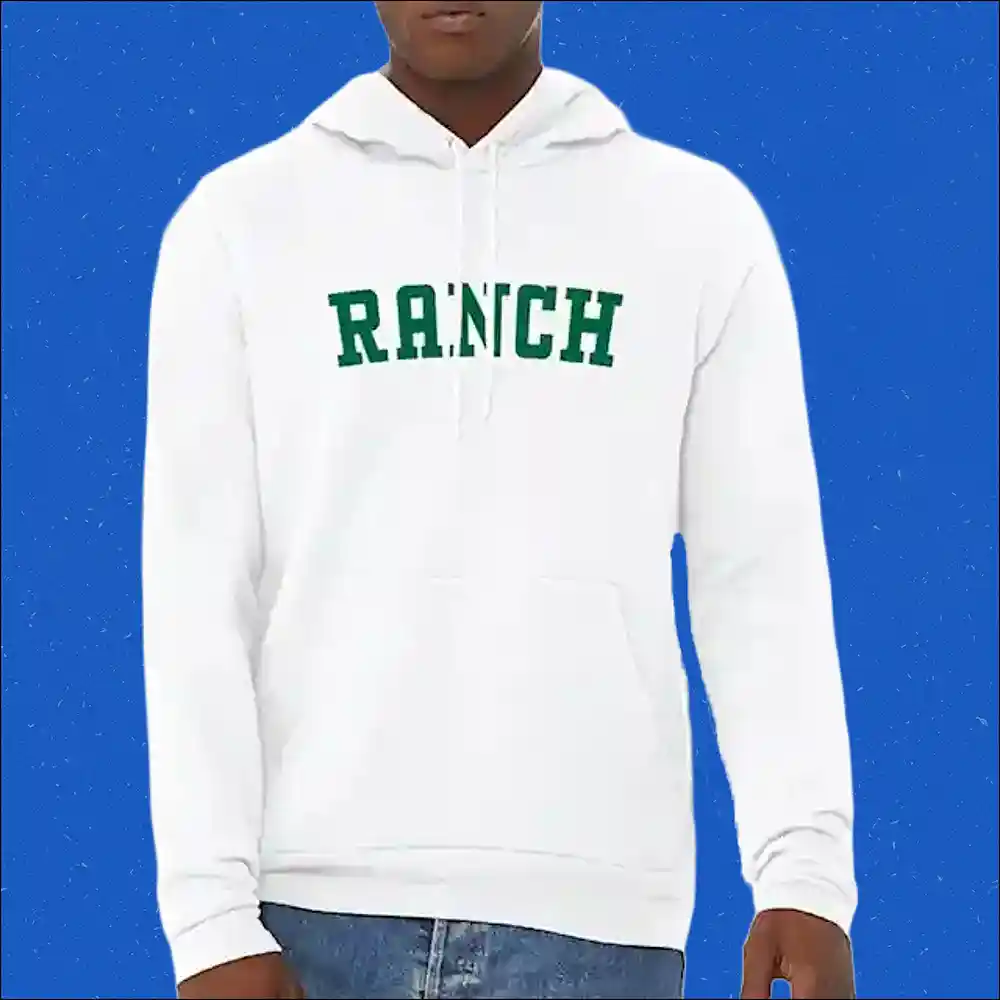 Person wearing a white sweatshirt with the word "Ranch" in green