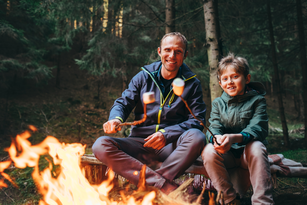 Summer-Camping-Trip-Roasting-Marshmallows-Around-Campfire-Smores 616109420