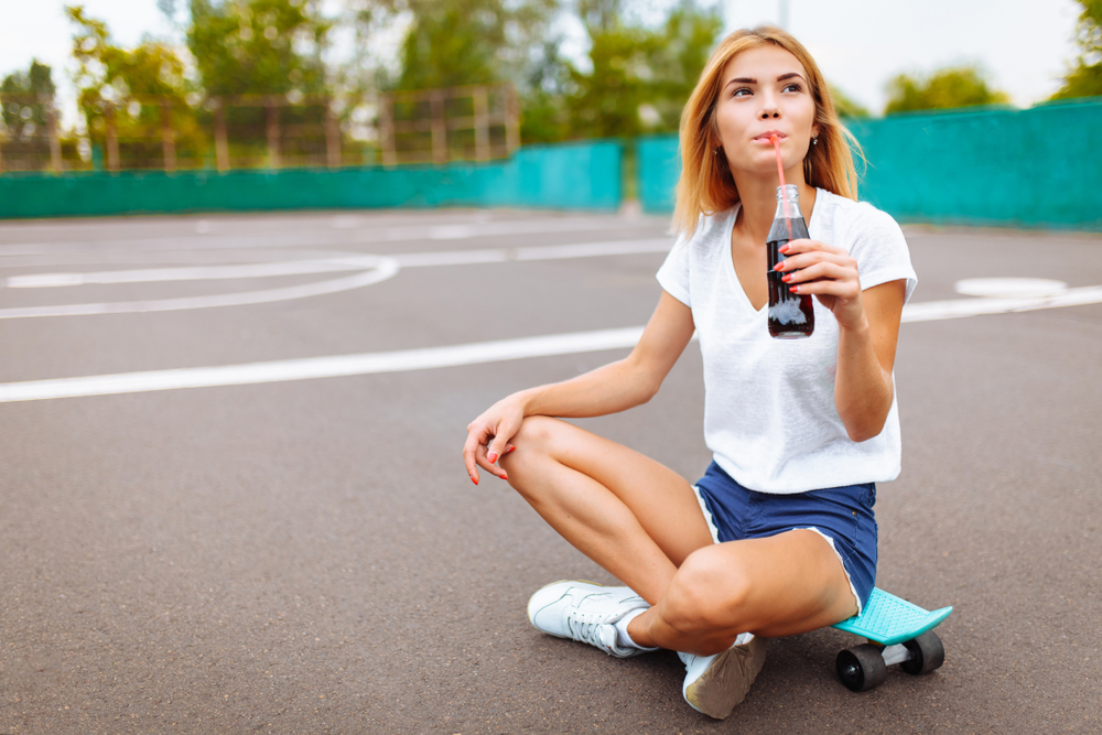 Ice-Cold-Glass-Bottle-Soda-Pop-on-Hot-Summer-Days 1162233685
