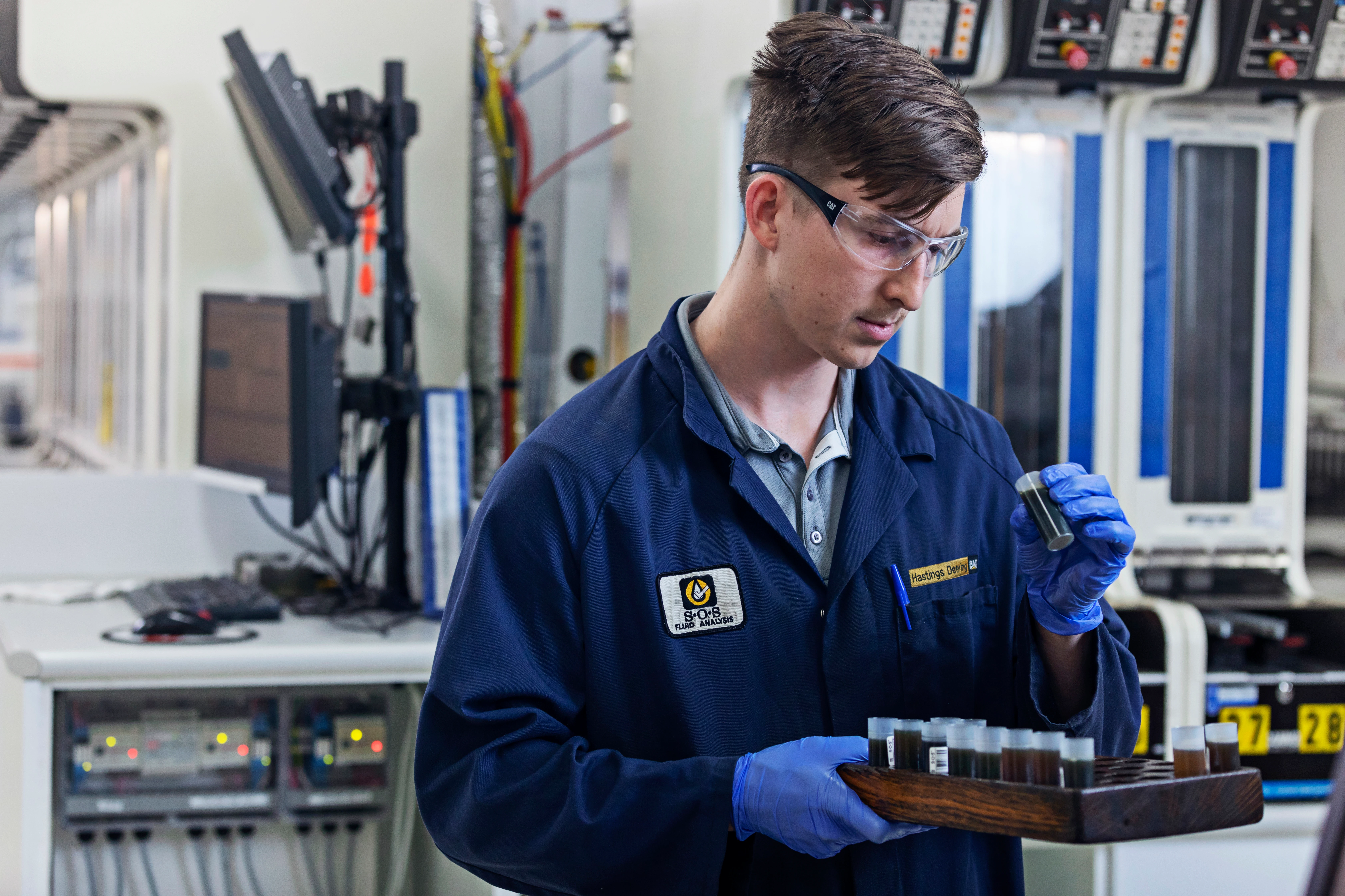 SOS Oil Commander Lab Tech exampling sample close