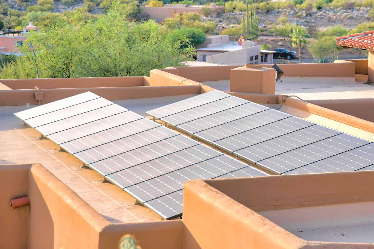 Solar panels on a flat roof of a mediterranean house