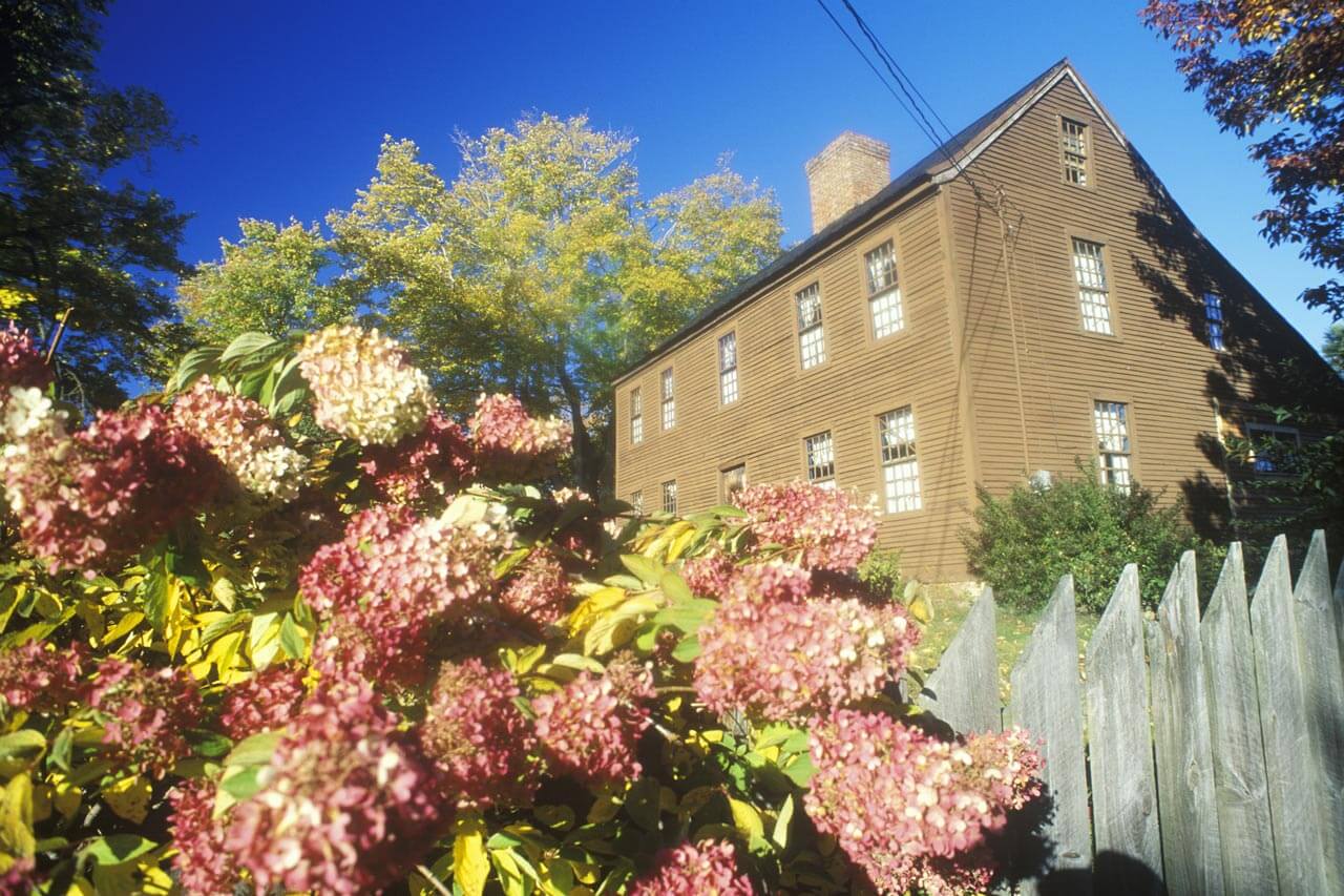 A wooden saltbox house in spring