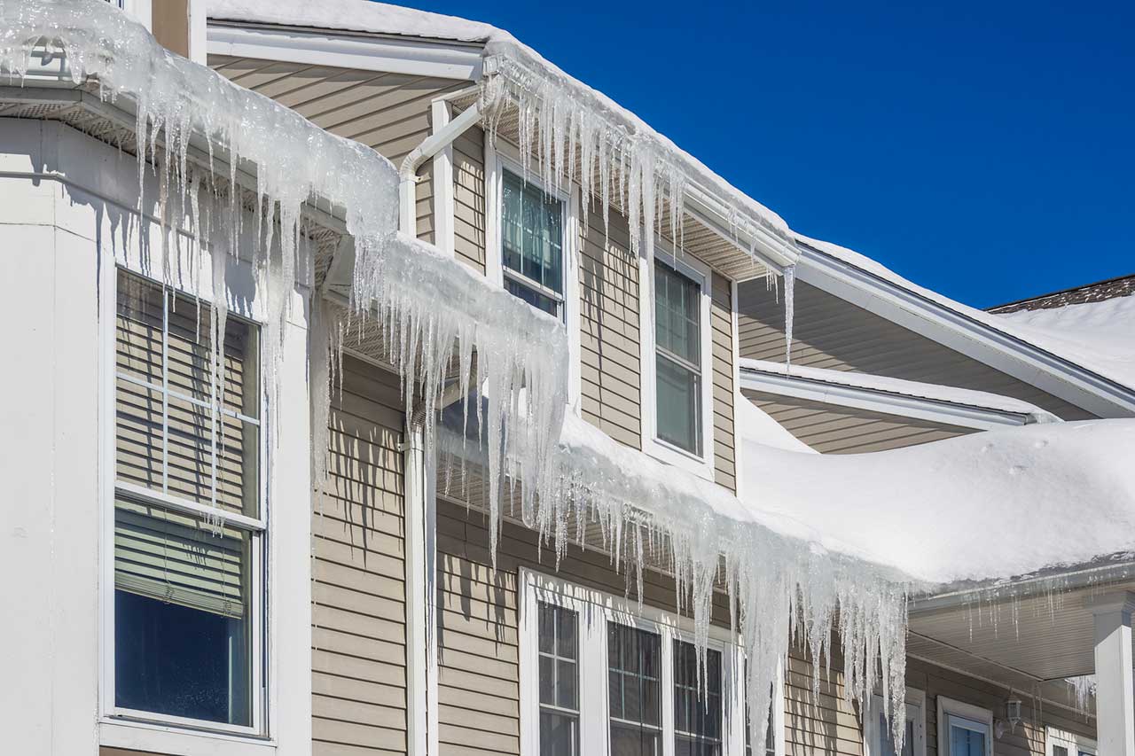 House with snow and ice dams on the roof