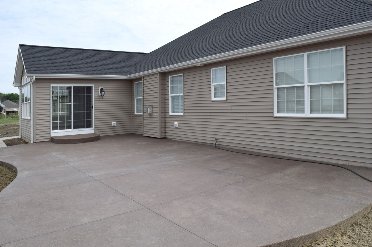 Newly Built Concrete Patio On Back Of House 