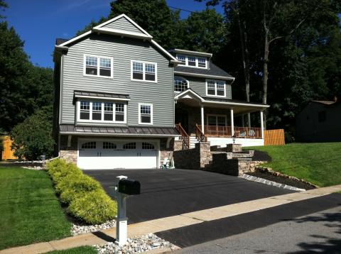 House with a new asphalt driveway