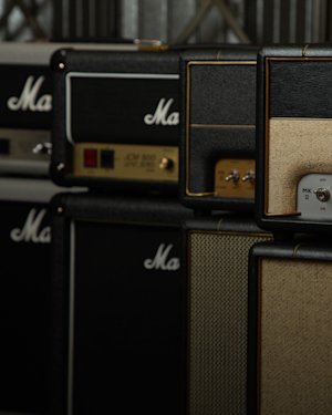 Marshall amps lined up next to each other.