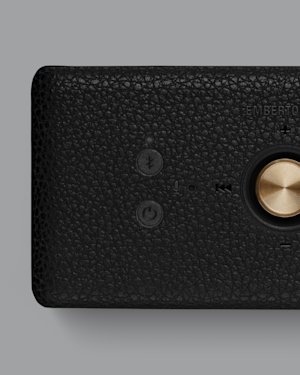 The Bluetooth button on top of a Marshall Emberton III speaker.