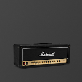 A black and brass Marshall DSL100 guitar amplifier head against a plain dark gray background.