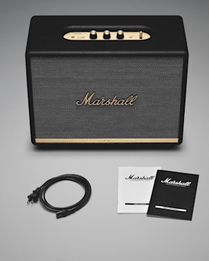 The box content of a Woburn II Bluetooth speaker. Speaker, quick start guide, important safety instructions and a mains lead.