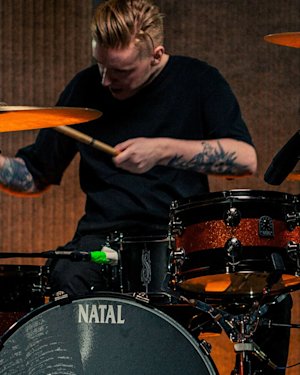 A drummer playing on his Natal snare drums.