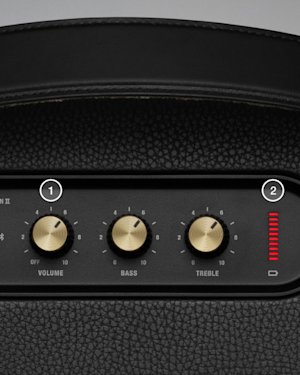 Altavoz Kilburn II visto desde arriba. El botón de volumen y el indicador de batería están marcados con 1 y 2, de izquierda a derecha.