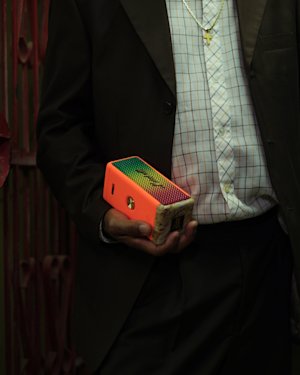 A man holding in Marshall's portable speaker Patta.