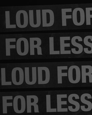 Grey tapes with the words 'LOUD FOR LESS' on them