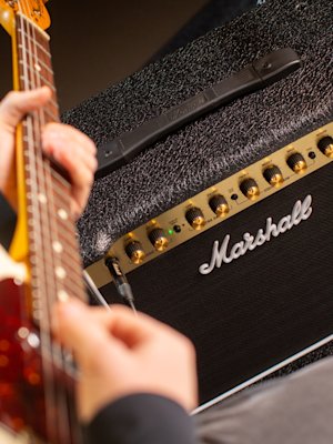 Guitar next to the Marshall DSL5 Combo amplifier.