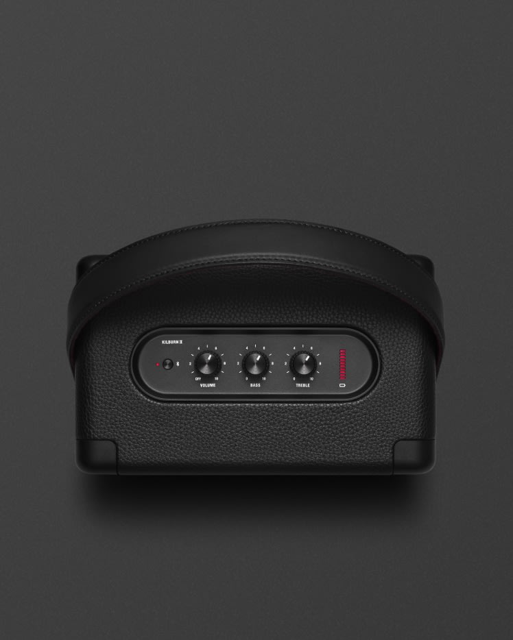 A black Marshall KILBURN II BLACK speaker on a black surface.