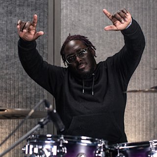 Jonathon Rodney posing for a photo at the Natal drums studio