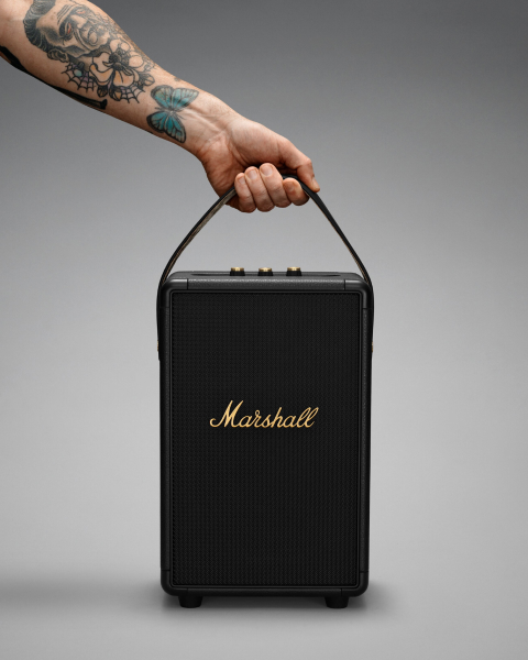 Someone holding a Marshall Tufton speaker with a handle