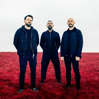 The band 'Therapy?' in a red field.