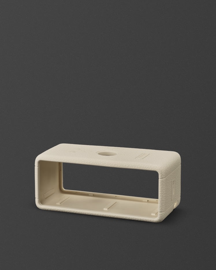 An Emberton II Sleeve Cream against a dark background.