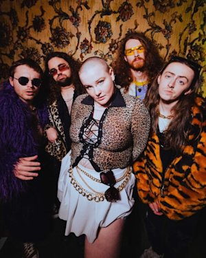 A band of 5 people staring at the camera.