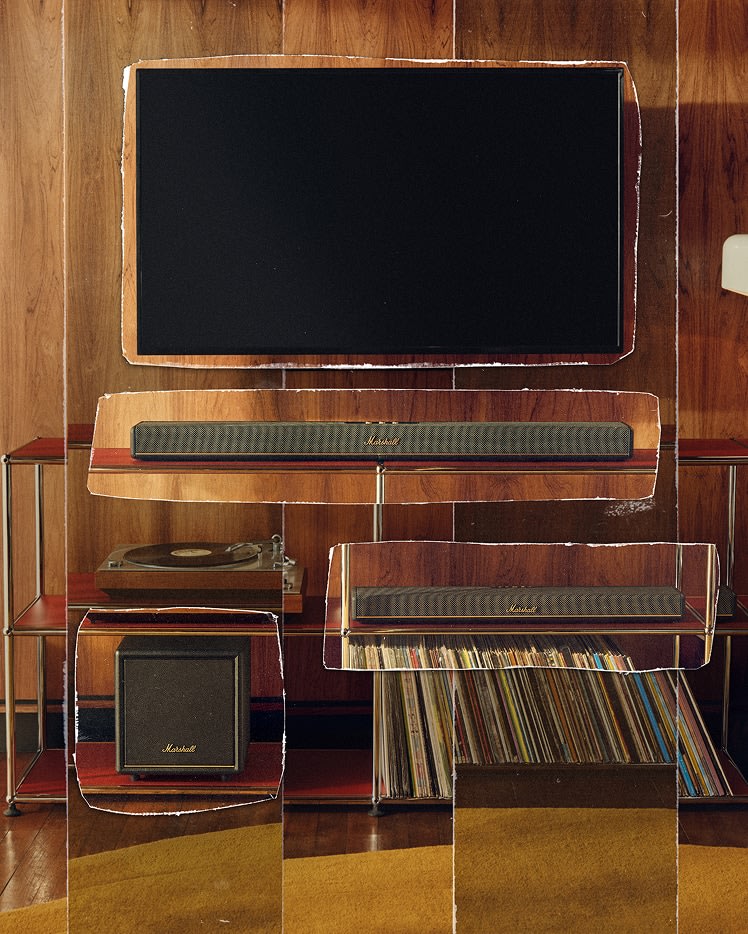 Marshall Heston soundbar and TV subwoofer are arranged on wooden shelves against a wood-paneled wall.