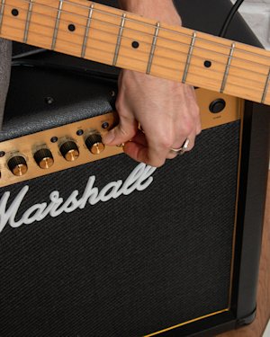 A person adjusting the MG50GFX Combo