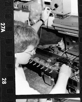 A man is working on a Marshall JVM410 Head.
