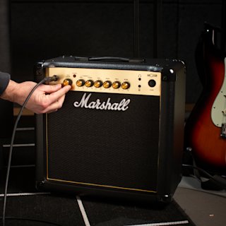 Tuning up the Marshall MG15GR Combo amplifier in the rehearsal room.