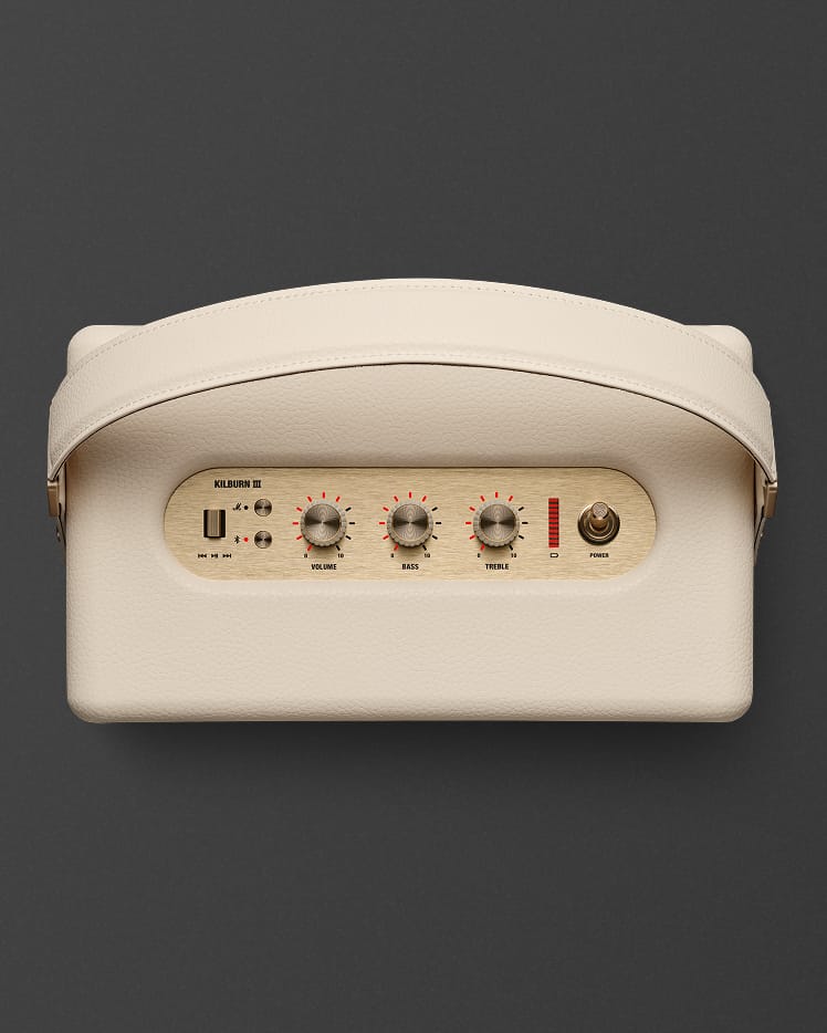 Marshall Kilburn III Cream portable speaker shown from above with a control panel featuring three knobs, a power switch, and input ports.