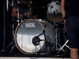Zoomed image on the Natal drums whilst played by a drummer.
