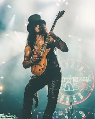 Slash playing guitar on stage for Guns 'n' Roses